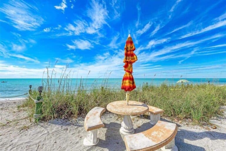 Fishermans Haven Condos in Siesta Key, FL. - Beach umbrella and Table
