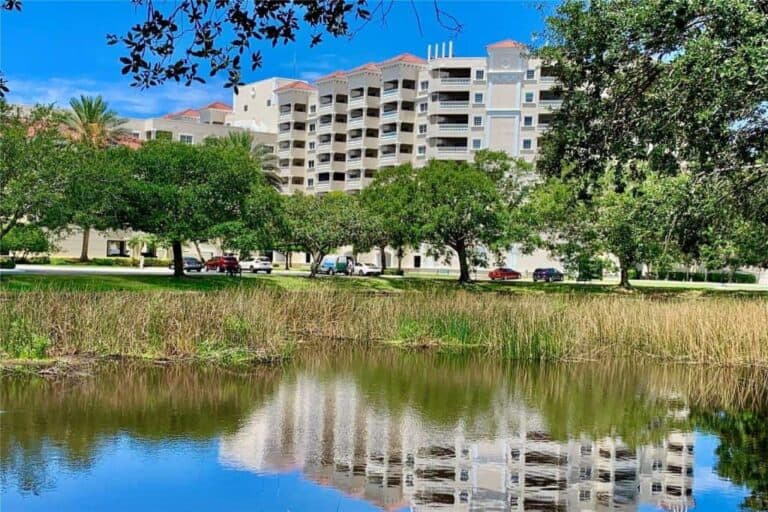 Woodmere at Jacaranda Condos in Venice, FL. - Building and Pond