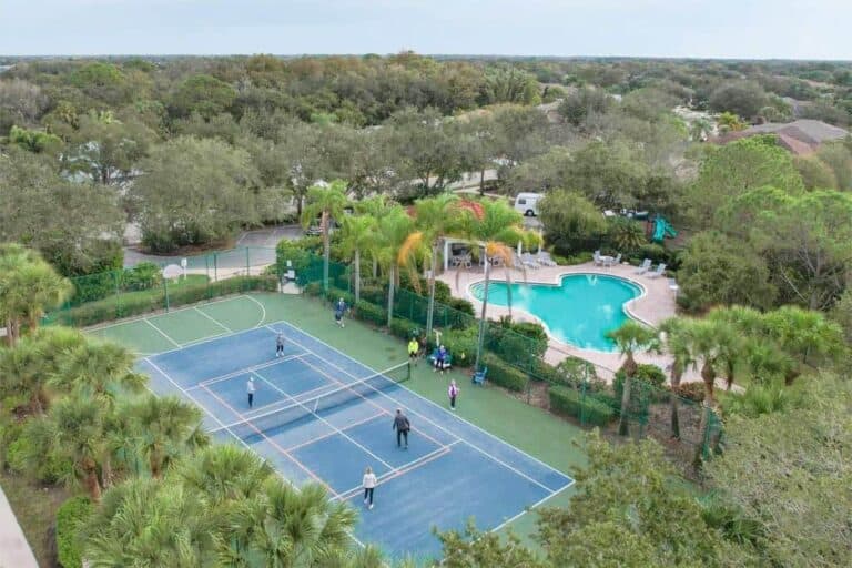 Carlyle at Palm Aire Homes in Sarasota, FL. - Pickleball &amp; Pool Aerial