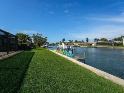 Emerald Harbor Homes in Longboat Key, FL. - Canal and Rear Yards