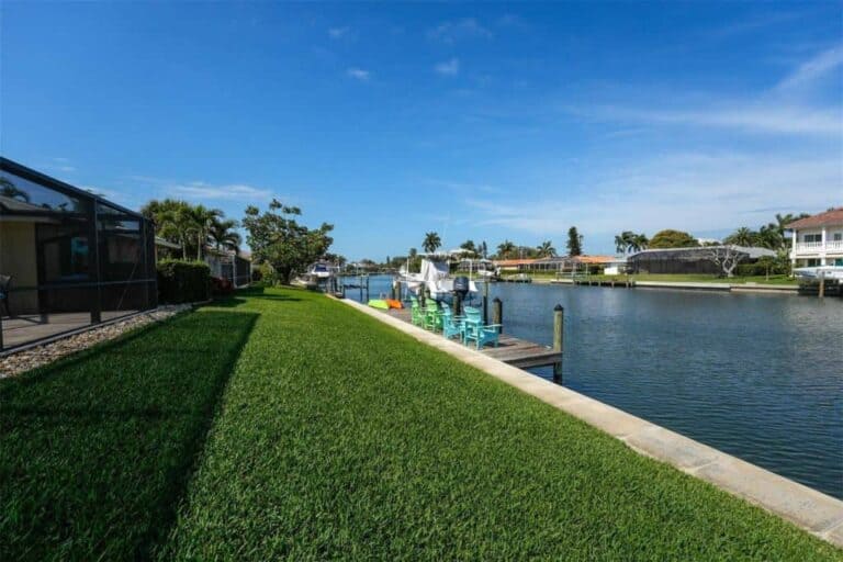Emerald Harbor Homes in Longboat Key, FL. - Canal and Rear Yards