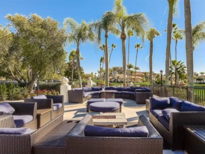 Peridia Homes in Bradenton, FL. - Clubhouse Patio and Fire Table