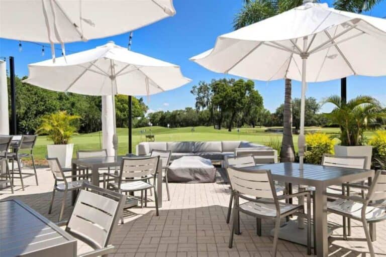 Rosedale Homes in Bradenton, FL. - Clubhouse Patio with Umbrellas
