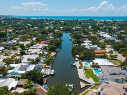 Sara Sands Homes in Siesta Key, FL. - Canal Aerial