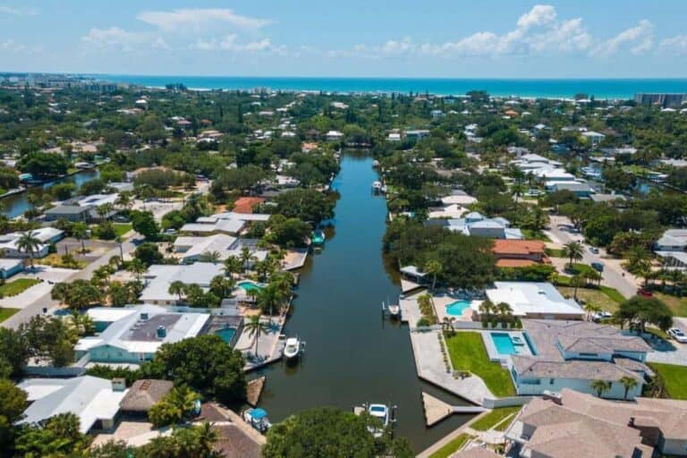 Sara Sands Homes in Siesta Key, FL. - Canal Aerial