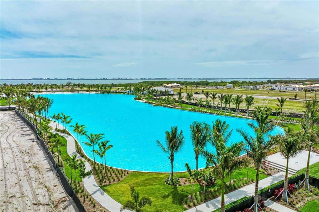 Pool surrounded by palm trees at Aqua Lagoon in Bradenton, Florida.