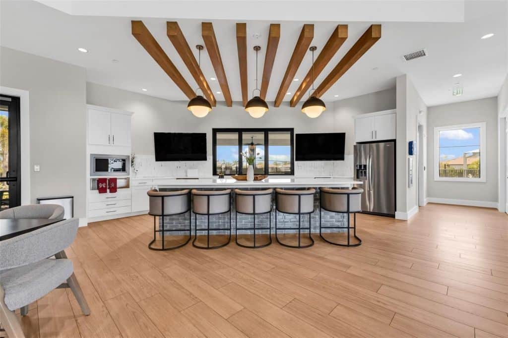 Kitchen with a large island and bar seating at Arbor Oaks in North Port, Florida