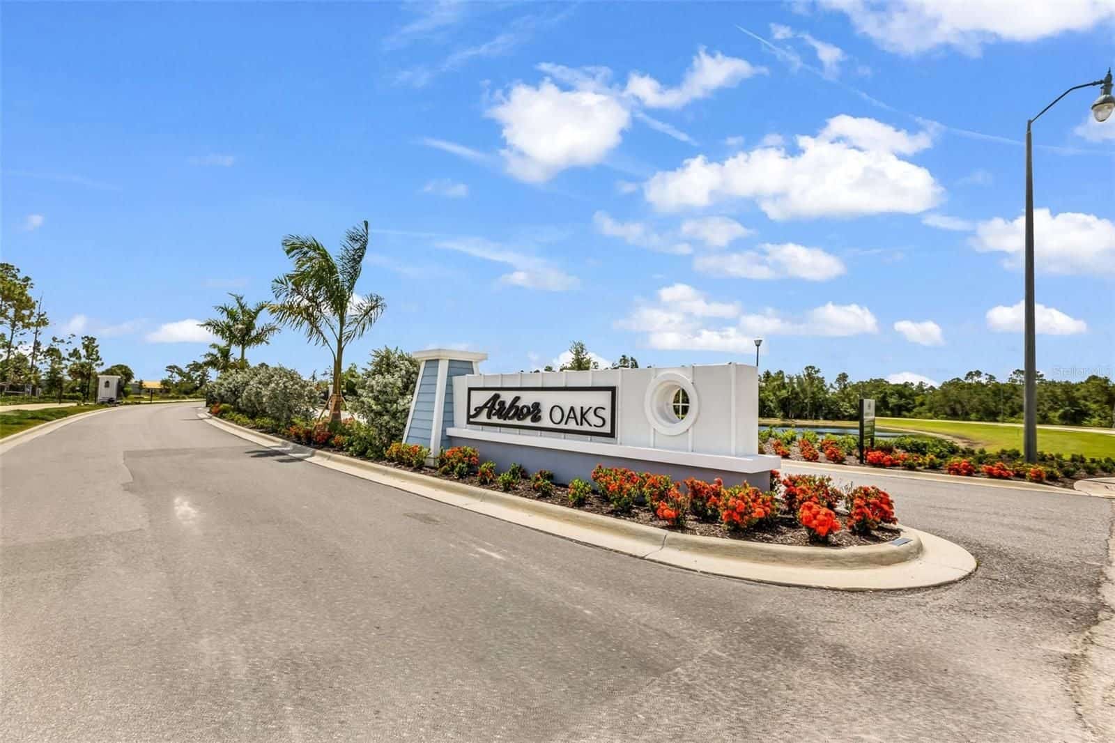 Arbor Oaks entrance sign with landscaping at Arbor Oaks in North Port, Florida
