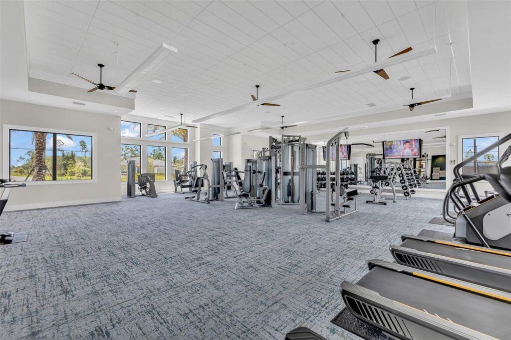 Fitness center with exercise equipment at Arbor Oaks in North Port, Florida