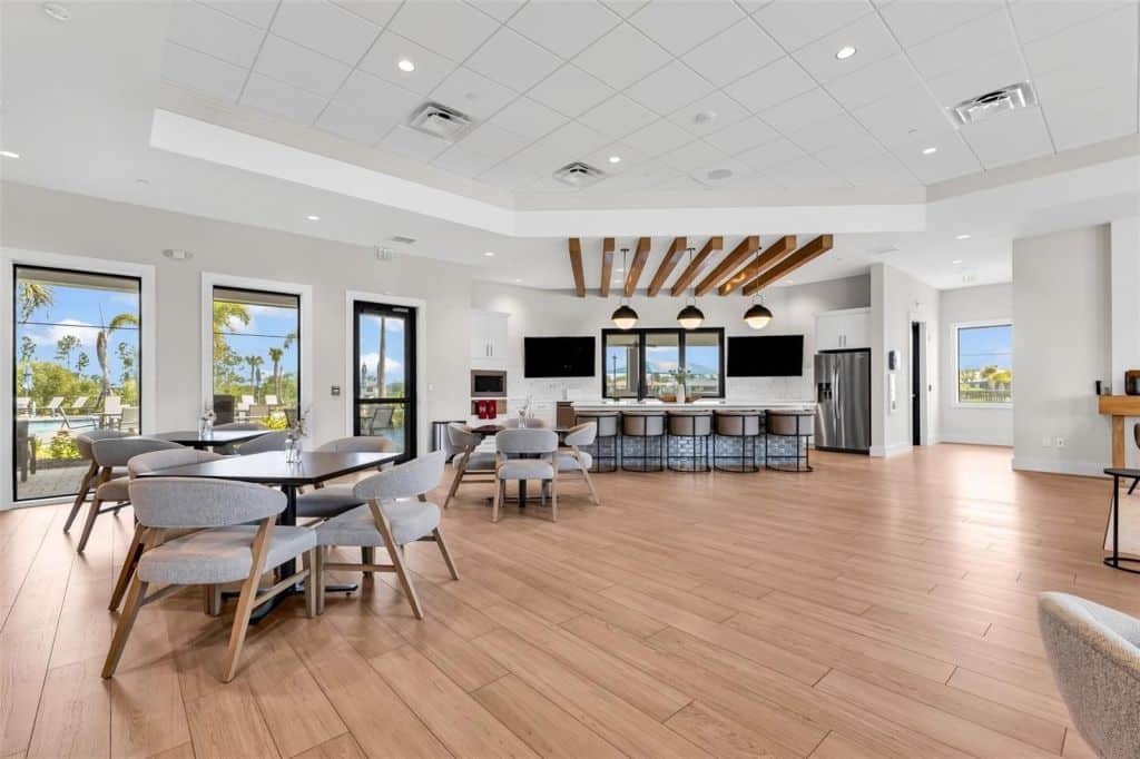 Common area with seating and large windows at Arbor Oaks in North Port, Florida